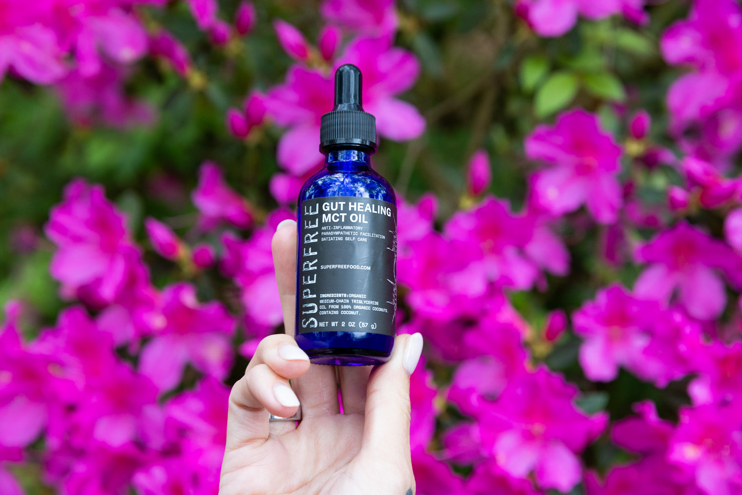 Superfree Gut MCT Oil bottle with flowers