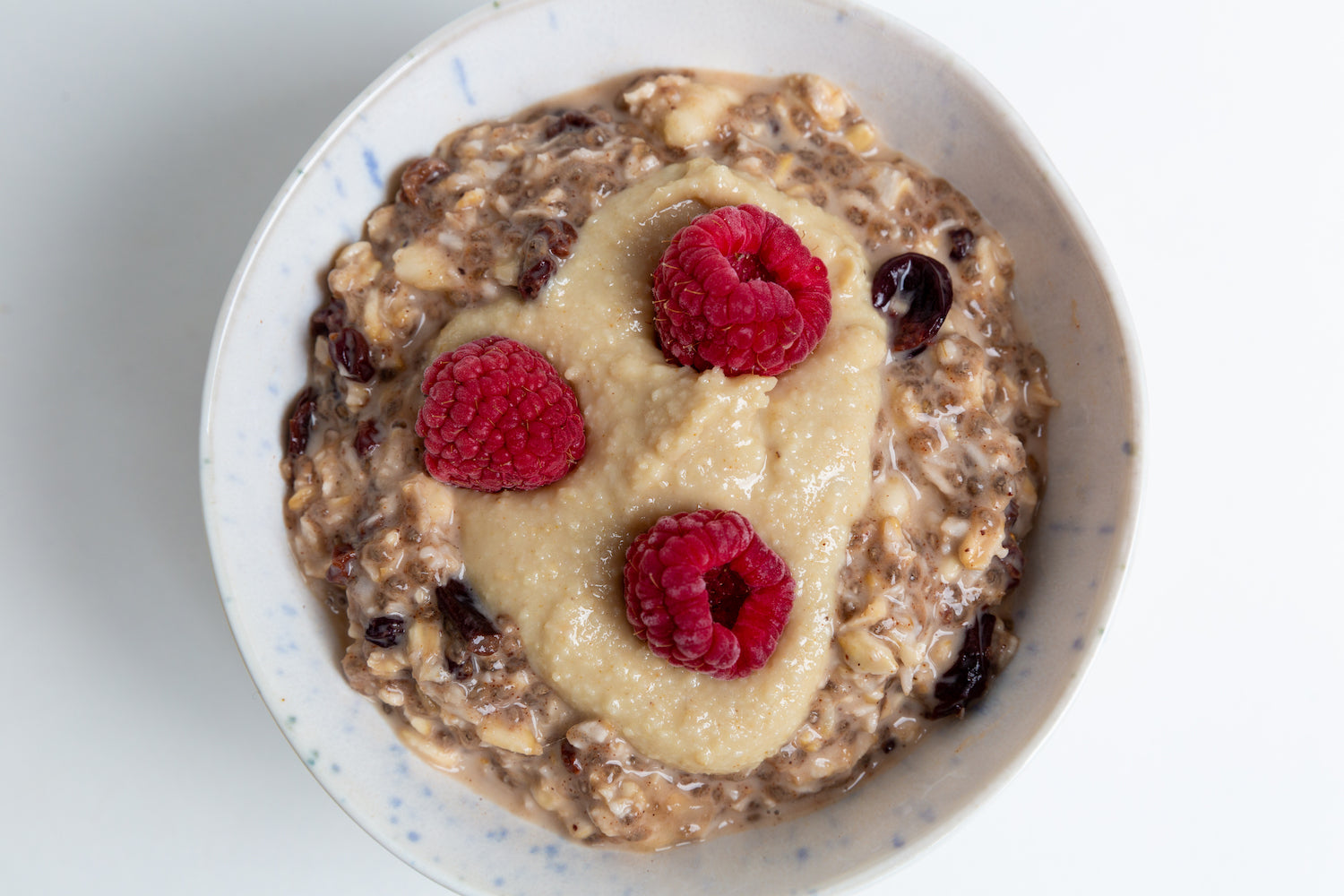 Superfree Adaptogenic Chia Oat bowl with Raw Maca Maca and raspeberries